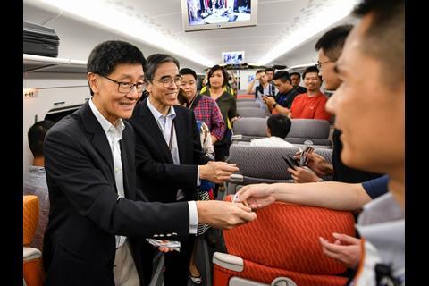 Hong Kong’s, Secretary for Transport & Housing Frank Chan, MTR Chairman Frederick Ma and CEO Lincoln Leong distributed gifts at West Kowloon to passengers travelling on the first public trains.